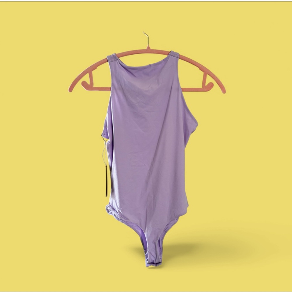 SKIMS body suit fit everybody. NWT